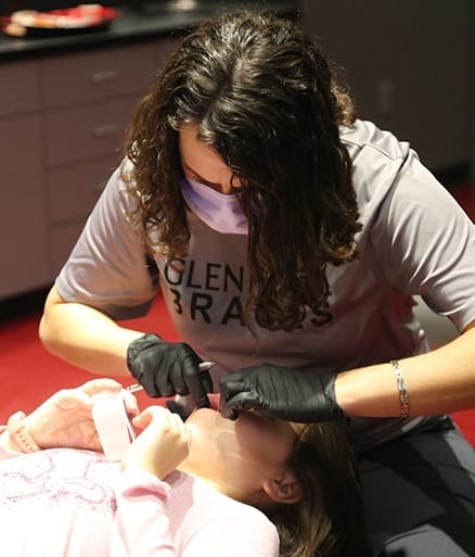 Dentist treating child during children's dentistry visit