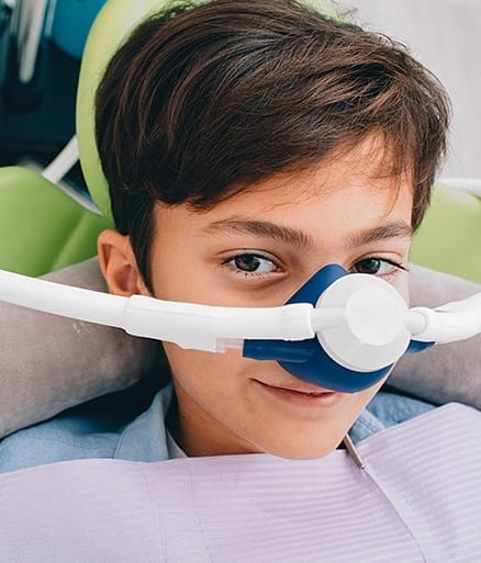 Patient with nitrous oxide dental sedation mask in place
