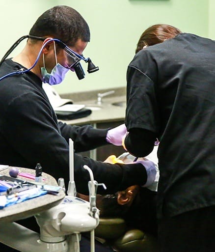 Dentists providing bone grafting treatment