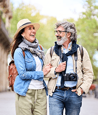 a mature couple with dentures traveling together