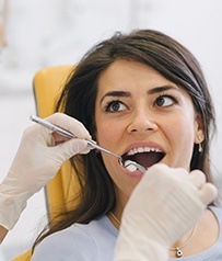 Dentist providing tooth extraction site preservation