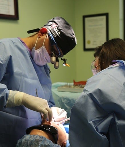 Dentist completing the tooth extraction process