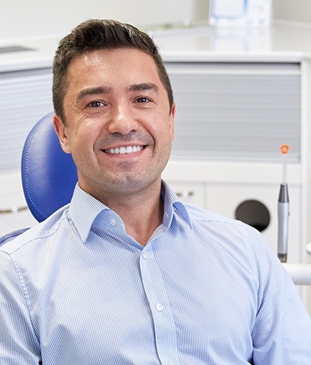 Man smiling after full mouth rehabilitation