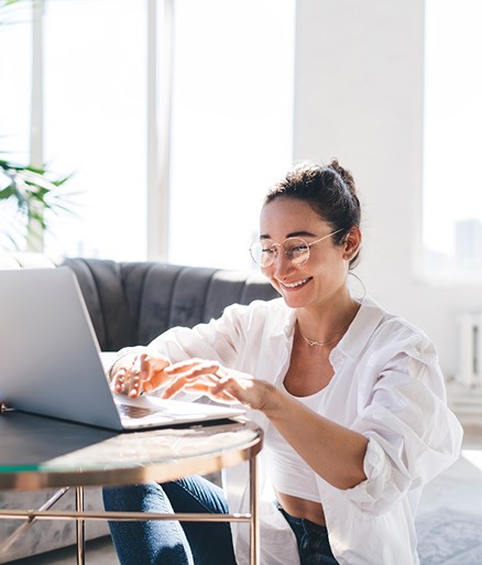 Woman smiling while working at home