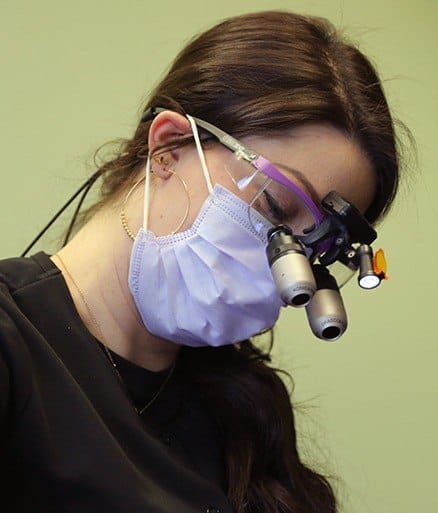 Doctor MacLeod treating dental patient