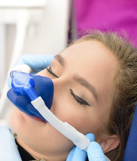 Patient receiving dental treatment under nitrous oxide dental sedation
