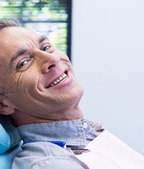 Man smiling after awakening from oral conscious sedation in Glenpool