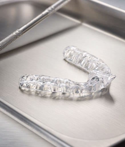 Clear nightguard for bruxism on metal tray